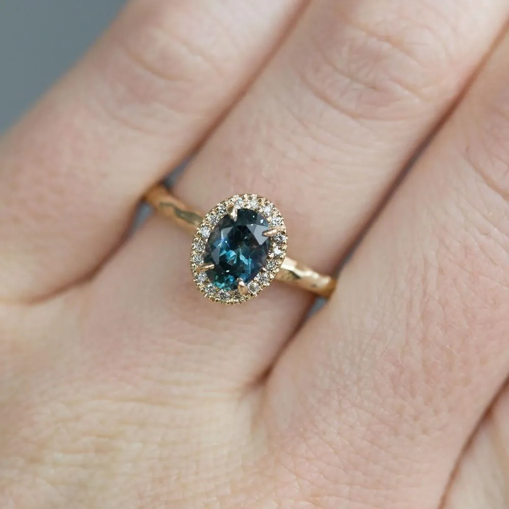 1.04ct Blue Montana Sapphire in 14k Yellow Gold Evergreen Diamond Halo